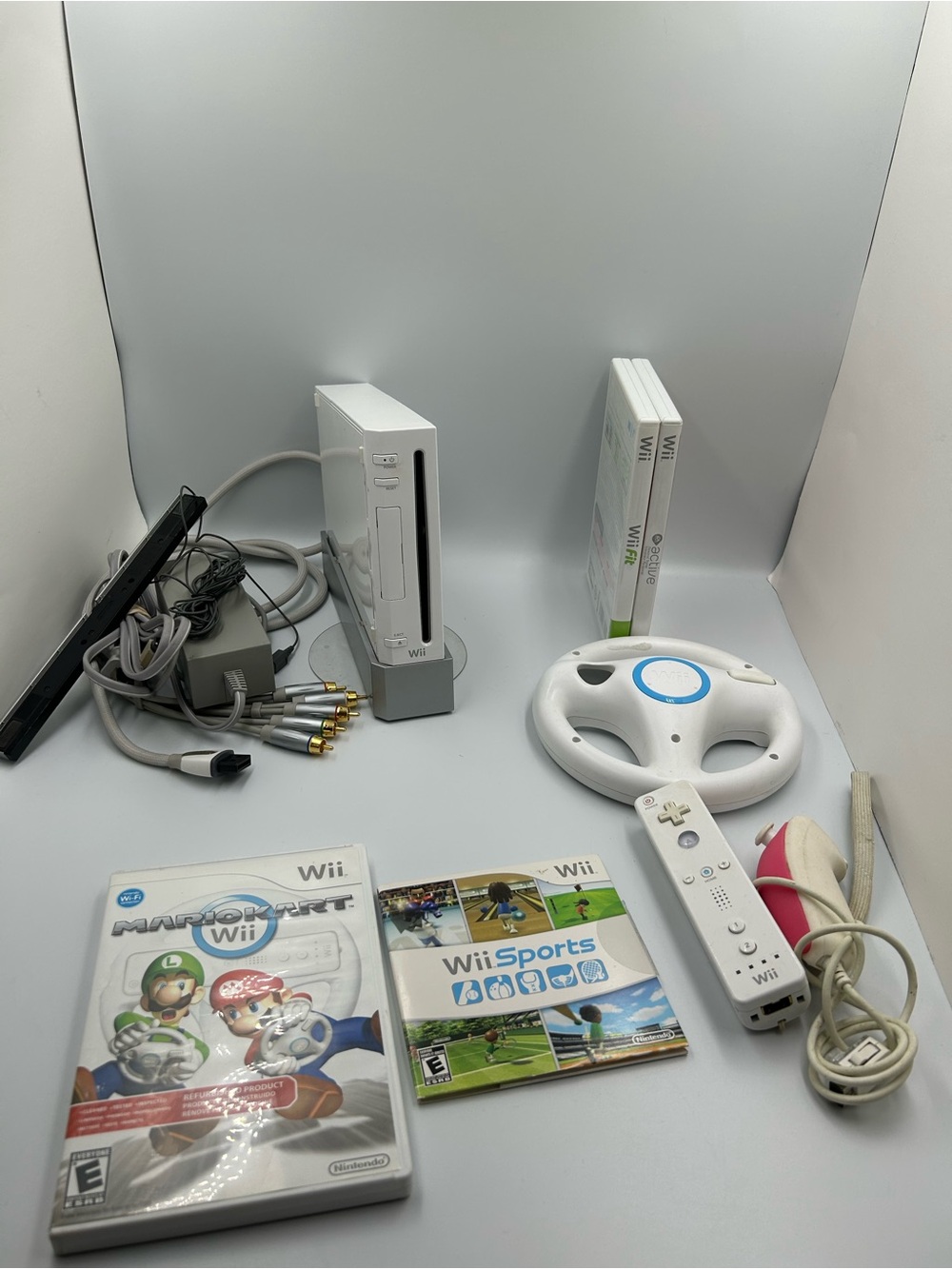 Nintendo RVL-101 Wii Console - (White) with controllers and games bundle